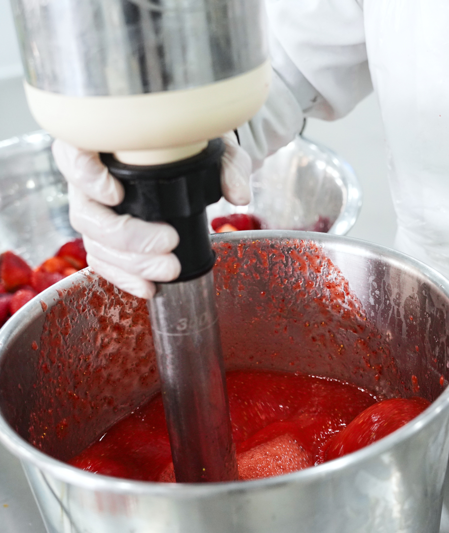 Handcrafted ice cream being prepared in artisan kitchen